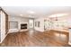 Open floor plan features a fireplace, hardwood floors and sliding glass doors at 10516 Beacon Ln, Indianapolis, IN 46256