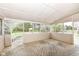 Screened patio overlooking a spacious yard and lush green trees at 10516 Beacon Ln, Indianapolis, IN 46256