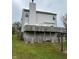 Backyard view of a two-story home with a spacious wooden deck at 10711 Regis Ct, Indianapolis, IN 46239