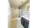 Well-lit bathroom with a shower-tub combo and modern vanity at 10711 Regis Ct, Indianapolis, IN 46239