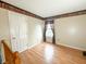Cozy bedroom with wood floors, neutral walls, and window that brings in natural light at 10711 Regis Ct, Indianapolis, IN 46239