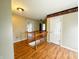 Upstairs hallway with railing and multiple doors leading to bedrooms and other living spaces at 10711 Regis Ct, Indianapolis, IN 46239