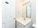 This powder room features a single sink and vanity with a mirror at 10944 Echo Trl, Indianapolis, IN 46236