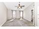 Light and airy bedroom with carpet, large windows, ample natural light, and a view to an en-suite bathroom at 10944 Echo Trl, Indianapolis, IN 46236