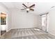 Spacious bedroom features neutral tones, ceiling fan, and an en suite bathroom for added convenience at 10944 Echo Trl, Indianapolis, IN 46236