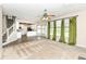 Inviting living room features neutral walls, carpet flooring, and open view of the kitchen and staircase at 10944 Echo Trl, Indianapolis, IN 46236