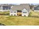 The backyard features a deck, well-maintained lawn, and stylish brick and siding exterior at 11392 Gammel Pl, Fishers, IN 46040