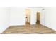This bedroom offers wood floors, white walls, and an open doorway to the en suite bathroom at 11392 Gammel Pl, Fishers, IN 46040