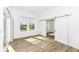 Bright bedroom with natural light, wood floors, and sliding barn doors create a welcoming atmosphere at 11392 Gammel Pl, Fishers, IN 46040