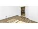 A clean bedroom with wood floors and open white doors, leading to a fireplace at 11392 Gammel Pl, Fishers, IN 46040