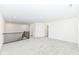 Expansive bonus room featuring neutral carpet, modern railing, and bright lighting, offering an inviting open layout at 11392 Gammel Pl, Fishers, IN 46040