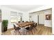 Elegant dining room featuring a large wooden table, modern chairs, and bright natural light at 11392 Gammel Pl, Fishers, IN 46040