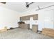 Spacious garage with modern cabinetry and granite countertops for ample storage and workspace at 11392 Gammel Pl, Fishers, IN 46040