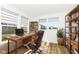 Bright home office featuring a wooden desk, comfortable chair, and ample natural light at 11392 Gammel Pl, Fishers, IN 46040