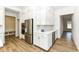 Open kitchen with stainless steel refrigerator, double oven appliances, and white cabinets at 11392 Gammel Pl, Fishers, IN 46040