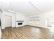 The living room features wood floors, recessed lighting, a fireplace, and a large window at 11392 Gammel Pl, Fishers, IN 46040