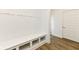Well-organized mudroom featuring a built-in bench with storage and hooks for coats, enhancing functionality at 11392 Gammel Pl, Fishers, IN 46040
