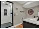 Updated bathroom featuring a glass shower and a gray vanity with modern fixtures at 11551 Buckskin Dr, Zionsville, IN 46077