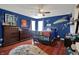 Unique themed bedroom with hardwood floors, detailed decor, and a fun and inviting atmosphere at 11551 Buckskin Dr, Zionsville, IN 46077