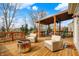 Outdoor deck area featuring comfortable seating, grill, and dining area perfect for entertaining at 11551 Buckskin Dr, Zionsville, IN 46077