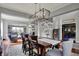 Elegant dining room with a modern chandelier and seating for six, perfect for entertaining at 11551 Buckskin Dr, Zionsville, IN 46077