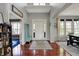Grand entryway with high ceilings, gleaming hardwood floors, and a stylish bench for added convenience at 11551 Buckskin Dr, Zionsville, IN 46077