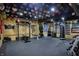 Spacious home gym featuring rubber flooring, weights, custom lighting, and sports memorabilia at 11551 Buckskin Dr, Zionsville, IN 46077