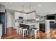 Stylish kitchen with white cabinets, granite countertops, and stainless steel appliances at 11551 Buckskin Dr, Zionsville, IN 46077