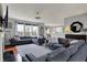 Spacious living room featuring hardwood floors, ample natural light, and comfortable seating at 11551 Buckskin Dr, Zionsville, IN 46077