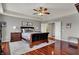 This is a large main bedroom that is equipped with hardwood floors, ceiling fan, and tray ceiling at 11551 Buckskin Dr, Zionsville, IN 46077