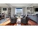 Cozy sitting area with hardwood floors, natural light, and comfortable seating at 11551 Buckskin Dr, Zionsville, IN 46077