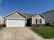 Charming ranch-style home with a two-car garage and well-maintained lawn at 11876 Wapiti Way, Noblesville, IN 46060