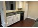 Bright kitchen offers white cabinets, stainless steel sink, dishwasher and hardwood floors at 11876 Wapiti Way, Noblesville, IN 46060