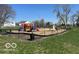 Community playground with swings, slides, and climbing structures at 11876 Wapiti Way, Noblesville, IN 46060