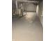 Basement with painted floor provides potential for customization and additional storage at 1216 N Holmes Ave, Indianapolis, IN 46222