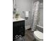 Well-lit bathroom features modern fixtures, a vanity with storage, and a shower/tub combo at 1216 N Holmes Ave, Indianapolis, IN 46222