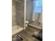 This is a spacious bathroom with tiled shower and a window providing natural light at 1216 N Holmes Ave, Indianapolis, IN 46222