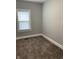 Cozy bedroom featuring neutral walls and plush carpeting, perfect for relaxation at 1216 N Holmes Ave, Indianapolis, IN 46222