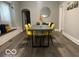Bright dining area with hardwood floors, contemporary furniture, and modern decor at 1216 N Holmes Ave, Indianapolis, IN 46222