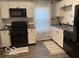 Well-lit kitchen with white cabinets, modern appliances, and stylish backsplash at 1216 N Holmes Ave, Indianapolis, IN 46222