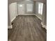 A bright, open-concept space featuring hardwood floors and neutral wall paint at 1216 N Holmes Ave, Indianapolis, IN 46222