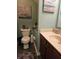 Cozy bathroom with decorative accents and wood-look flooring at 13124 S Elster Way, Fishers, IN 46037