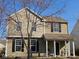 Charming two-story home features a well-maintained lawn and inviting front porch, nestled under a clear blue sky at 13124 S Elster Way, Fishers, IN 46037