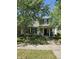 Charming two-story home featuring a covered front porch and well-maintained landscaping at 13124 S Elster Way, Fishers, IN 46037