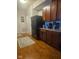 Functional kitchen layout with wooden cabinetry, black appliances, and ample counter space for meal preparation at 13124 S Elster Way, Fishers, IN 46037