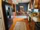 Traditional kitchen with wooden cabinetry, stainless steel refrigerator, and an adjacent dining area at 13124 S Elster Way, Fishers, IN 46037
