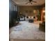 Spacious living room with a cozy seating arrangement, ceiling fan, and a decorative rug creating a comfortable atmosphere at 13124 S Elster Way, Fishers, IN 46037