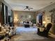 Inviting living room with ceiling fan, plush seating, and abundant natural light at 13124 S Elster Way, Fishers, IN 46037