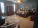 Spacious main bedroom with a four-poster bed, neutral tones, and ample natural light creating a serene retreat at 13124 S Elster Way, Fishers, IN 46037