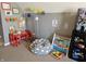 Kid-friendly playroom with beanbag chair, colorful decor, and toy storage at 13124 S Elster Way, Fishers, IN 46037